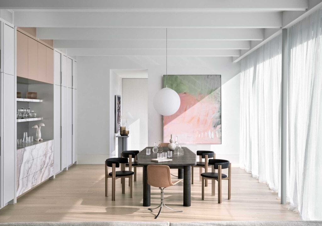 Contemporary oak floor dining area with large artwork
